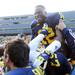 Michigan quarterback Devin Gardner is lifted in the air as Michigan celebrates beating Northwestern 38-31 in overtime at Michigan Stadium on Saturday. Melanie Maxwell I AnnArbor.com